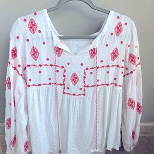White tunic with coral stitching